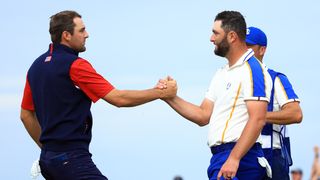 Scottie Scheffler shakes hands with Jon Rahm after his singles win in the 2021 Ryder Cup