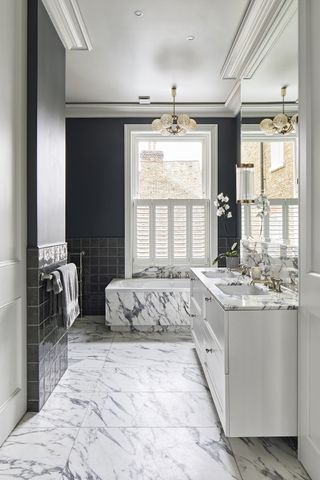 Black and white bathroom with marble and dark walls