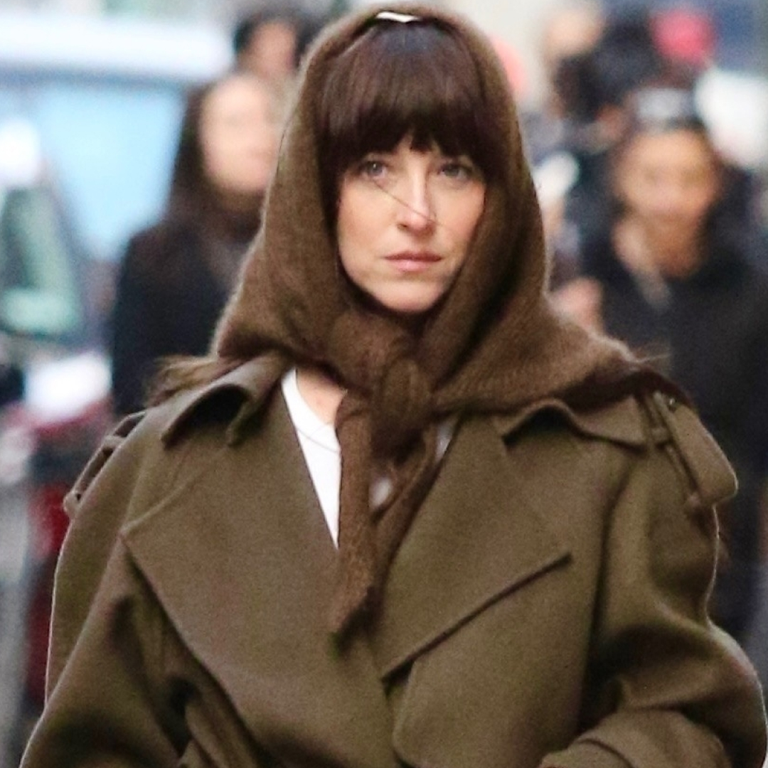 Dakota Johnson tested the triangle scarf trend with her wool The Row wrap coat and ballet flats
