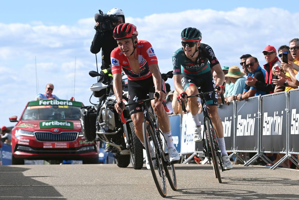 OBSERVATORIO ASTROFSICO DE JAVALAMBRE SPAIN AUGUST 31 LR Remco Evenepoel of Belgium and Team Soudal Quick Step Red Leader Jersey and Aleksandr Vlasov of Russia and Team BORA Hansgrohe cross the finish line during the 78th Tour of Spain 2023 Stage 6 a 1831km stage from La Vall dUix to Observatorio Astrofsico de Javalambre 1947m UCIWT on August 31 2023 in Observatorio Astrofsico de Javalambre Pico del Buitre Spain Photo by Tim de WaeleGetty Images