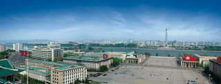 View from the Grand People's Study House across Kim Il-sung Square to Department Store No.1 and the Juche Tower