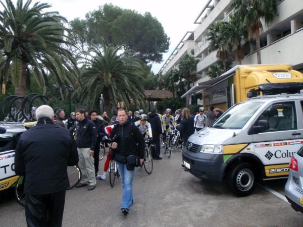 The riders wait for the ride to start outside the team hotel