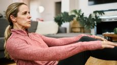 Woman in workout clothes exercising in a domestic setting
