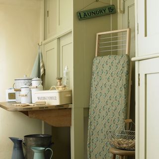 utility room with built in utility cupboard