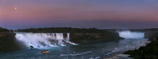 This panoramic photo by Miguel Claro shows a golden moon rising above Niagara Falls.