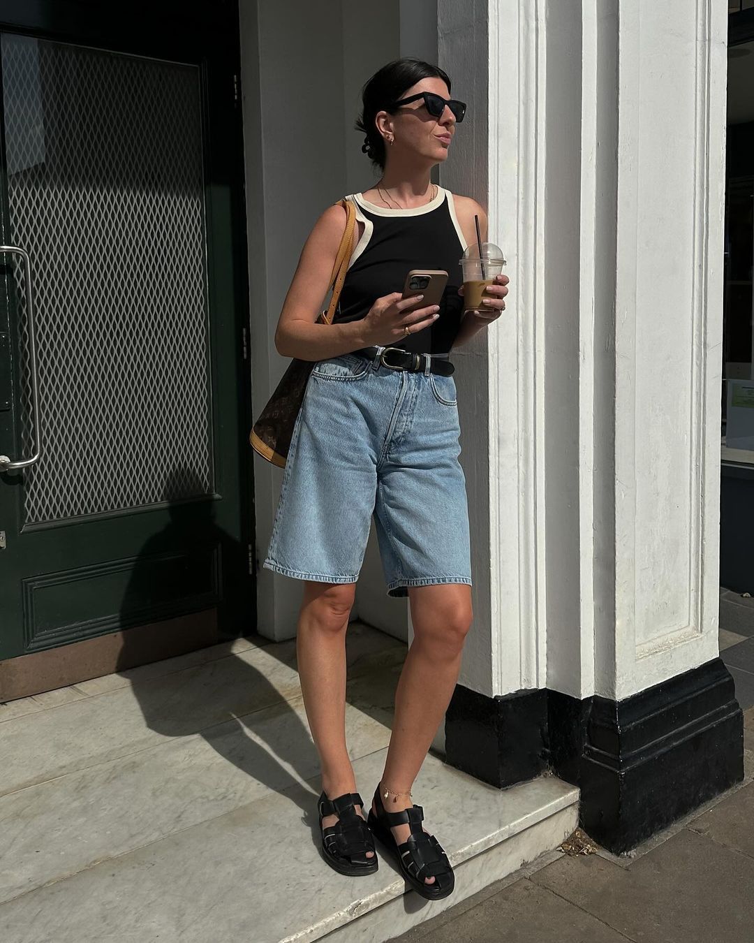 @francescasaffari wearing Bermuda denim shorts, two-tone tank and fisherman sandals