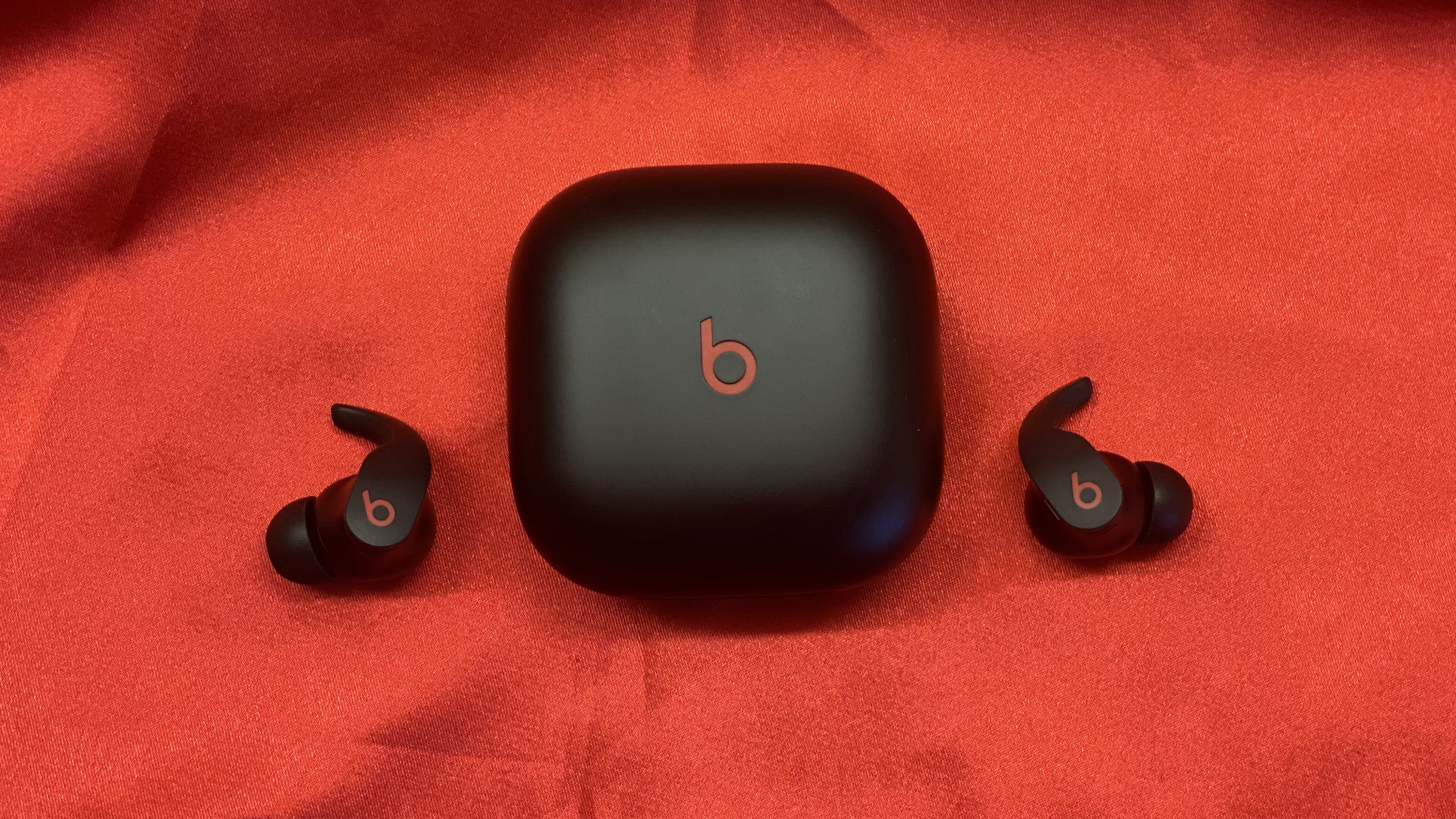 Beats Fit Pro on a red backdrop