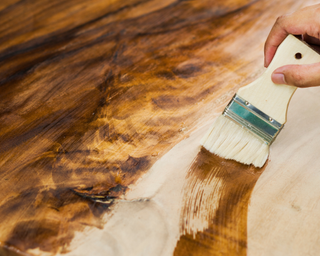 Staining wood with a brush