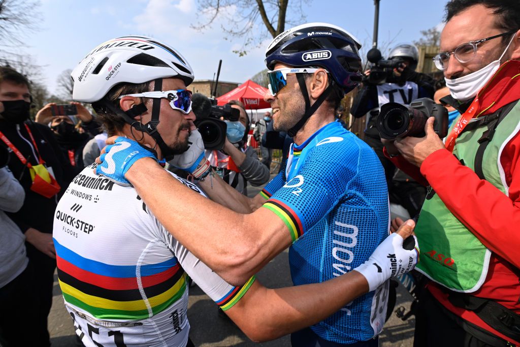 MUR DE HUY BELGIUM APRIL 21 Arrival Julian Alaphilippe of France and Team Deceuninck QuickStep Alejandro Valverde Belmonte of Spain and Movistar Team celebrate on arrival during the 85th La Fleche Wallonne 2021 Men Elite a 1936km race from Charleroi to Mur de Huy 204m FlecheWallonne on April 21 2021 in Mur de Huy Belgium Photo by Eric Lalmand PoolGetty Images