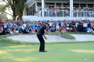 Phil Mickelson hits a putt in front of packed galleries at the 2018 WGC-Mexico Championship