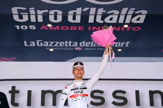 LAVARONE ITALY MAY 25 Joo Almeida of Portugal and UAE Team Emirates elebrates winning the white best young jersey on the podium ceremony after the 105th Giro dItalia 2022 Stage 17 a 168 km stage from Ponte di Legno to Lavarone 1161m Giro WorldTour on May 25 2022 in Lavarone Italy Photo by Tim de WaeleGetty Images