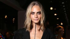 Cara Delevingne at Burberry black line down her chest