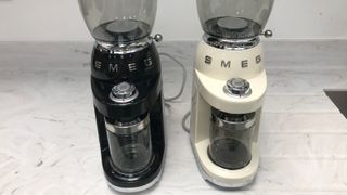Smeg grinders, side by side in cream and black