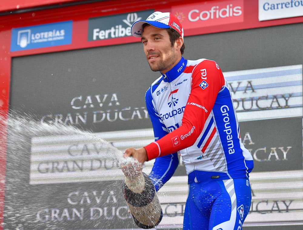 Thibaut Pinot celebrates on the Vuelta podium after winning stage 19
