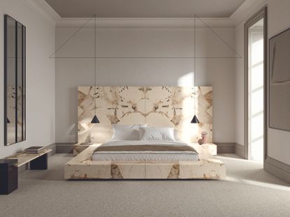 A bedroom with a marble stone bed surround and headboard