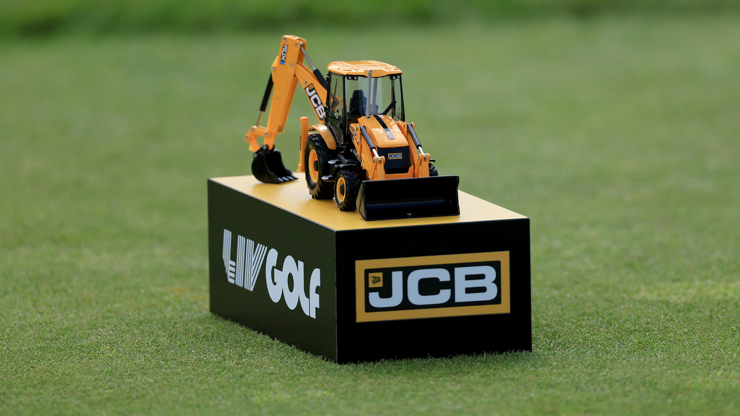 A JCB LIV Golf tee marker at LIV Golf UK