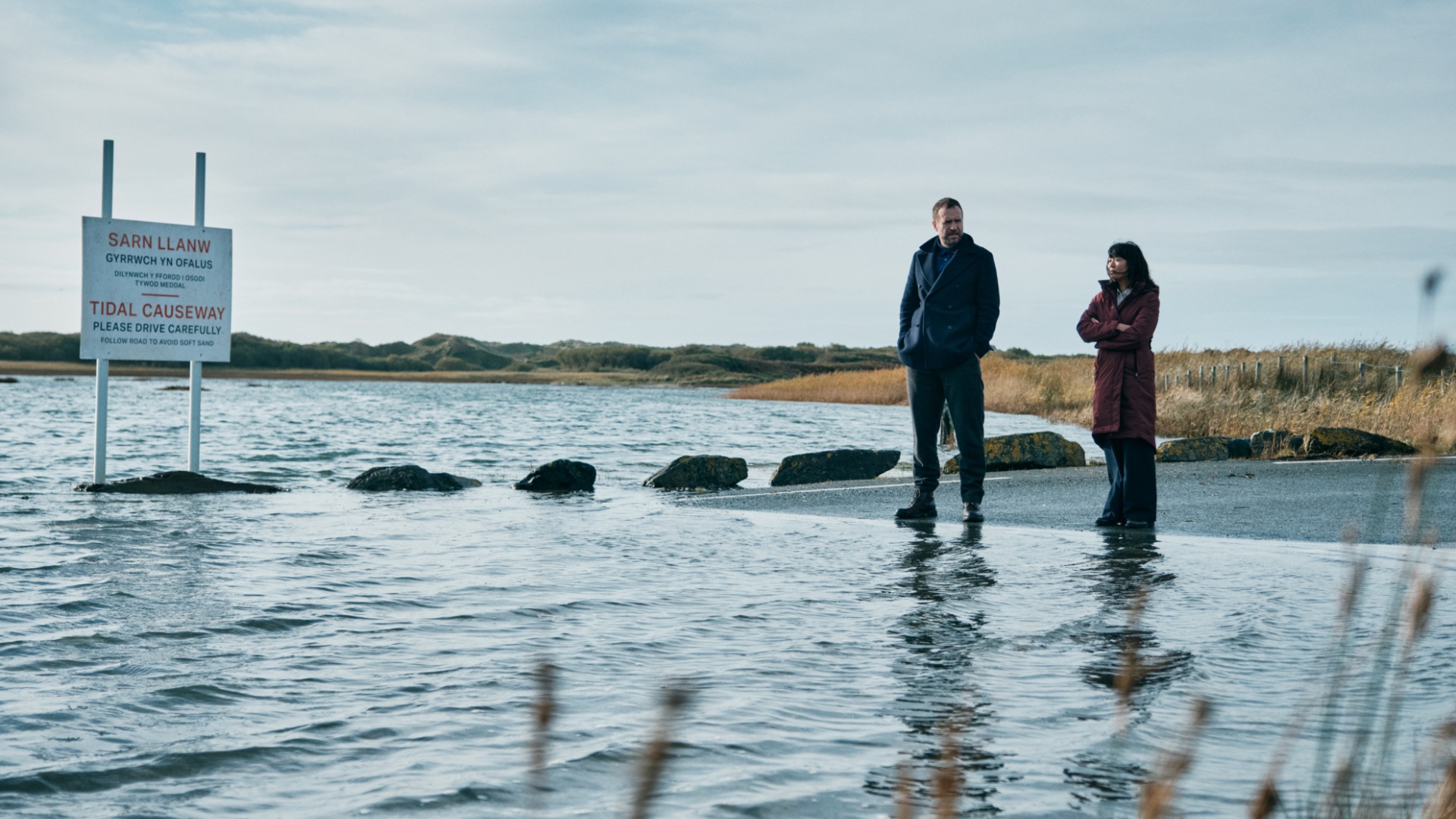 Rafe Spall as Eric Bull &amp;amp; Naomi Yang as Jess Deng in Under Salt Marsh