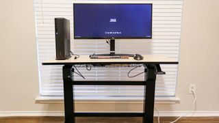 The Ergotron WorkFit D manual standing desk with a cable management tray from Ikea