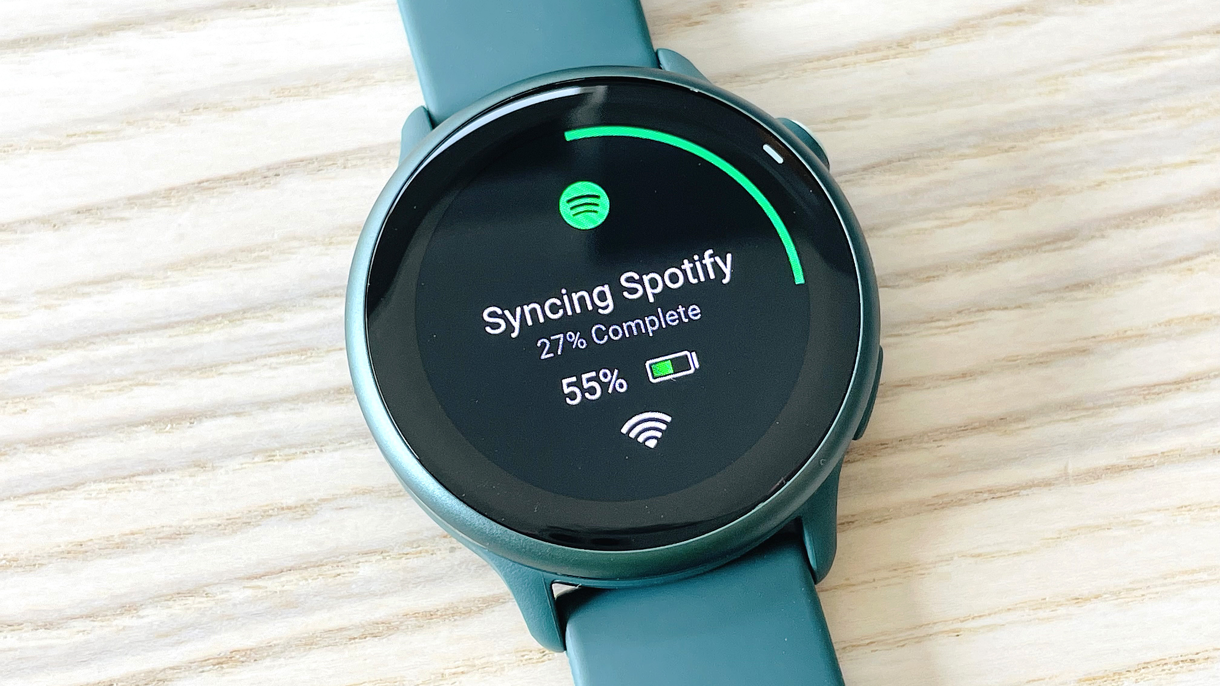 Garmin Vivoactive 6 close-up showing Spotify on the watch