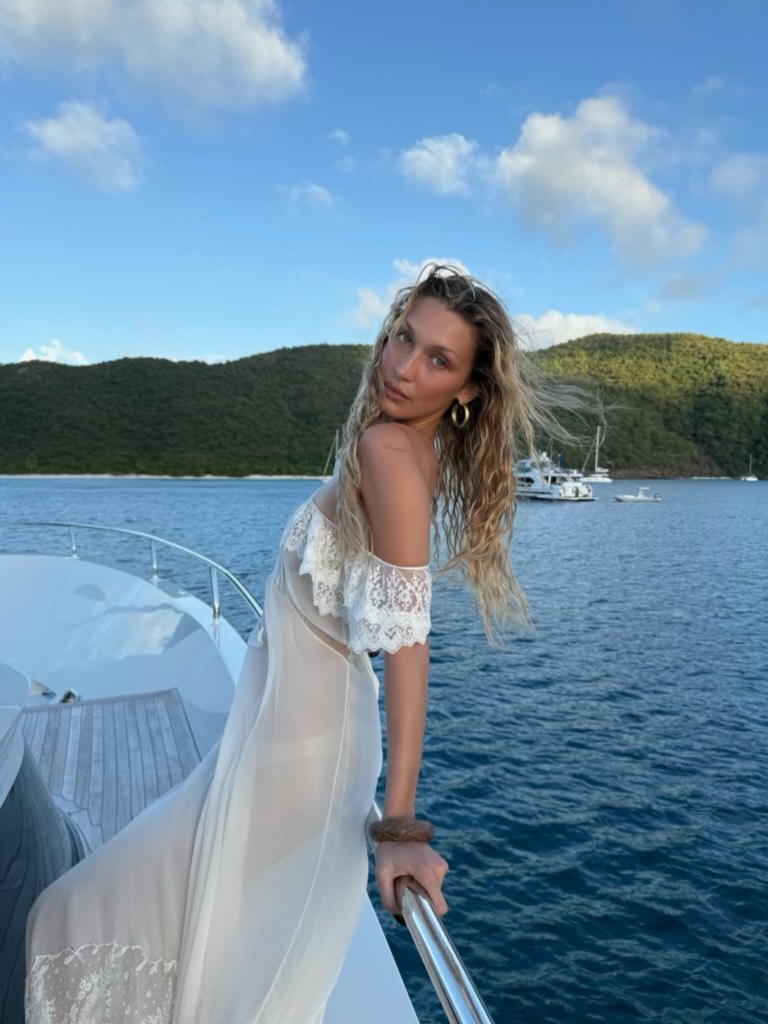 Bella Hadid posed on a yacht in a semi-sheer slip dress worthy of the mermaid summer trend