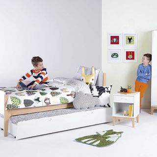 kids trundle bed with white flooring