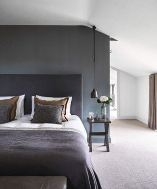 gray bedroom with beige carpet