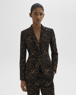 A model wearing a leopard print suit from Theory