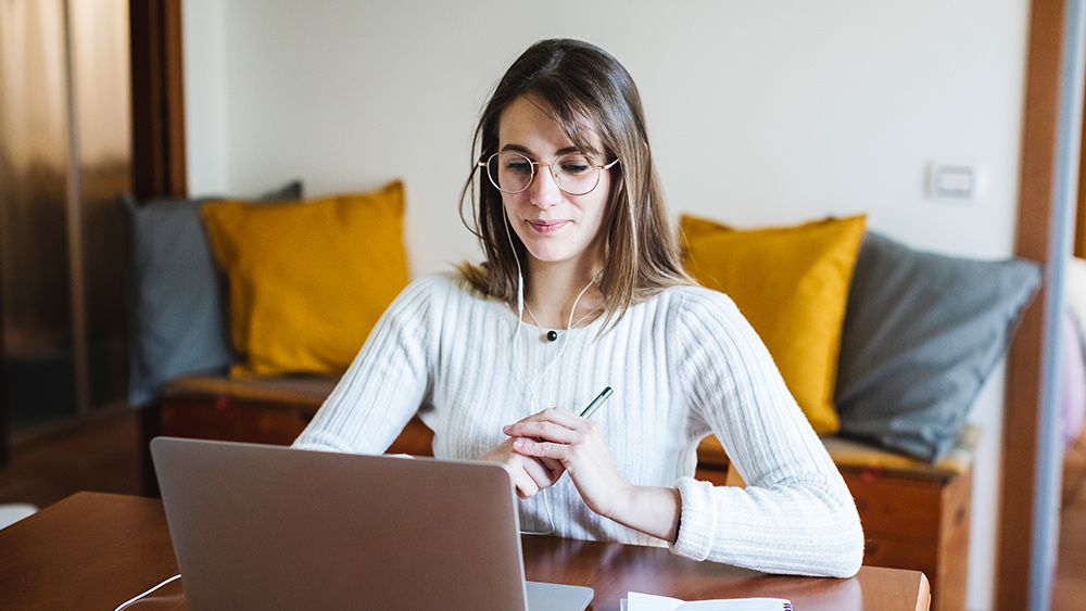 Student discounts - A student searches for the best student discount online using her laptop