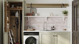 utility room with sage green cupboards, pink and white tiles, hanging drying rack and washing machine
