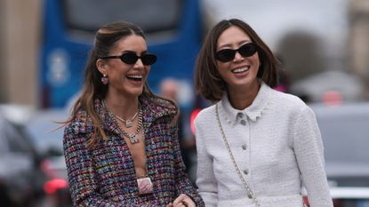 best spf moisturisers - Camila Coelho & Aimee Song seen wearing a long checkered and purple Chanel suit, white and black ballarinas, Chanel white handbag, sunglasses and a white Chanel dress, white Chanel bag, black sunglasses and white sandals outside Chanel show - gettyimages 2075791113