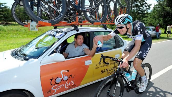 Lukasz Wisniowski is very happy to get a bidon from the team car