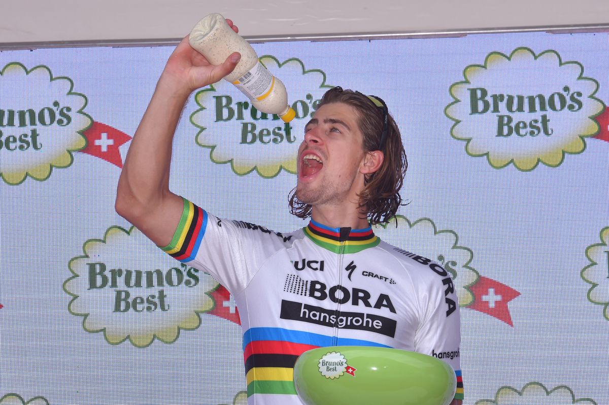 Peter Sagan (Bora-Hansgrohe) playing around on the podium
