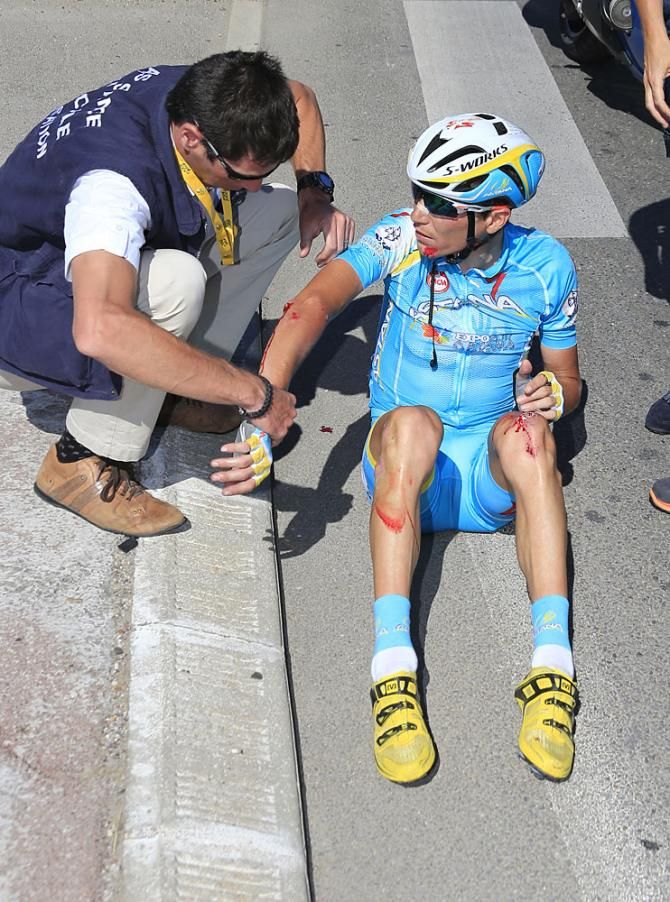 Janez Brajkovic (Astana) is checked out after a crash