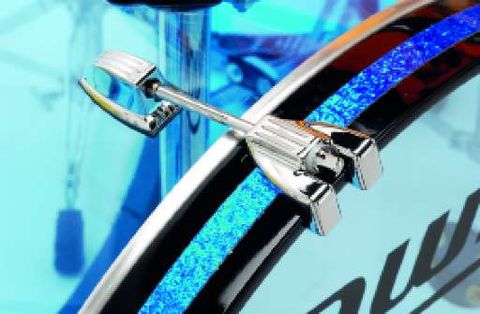 The bass drum has wooden hoops inlaid with blue glitter.