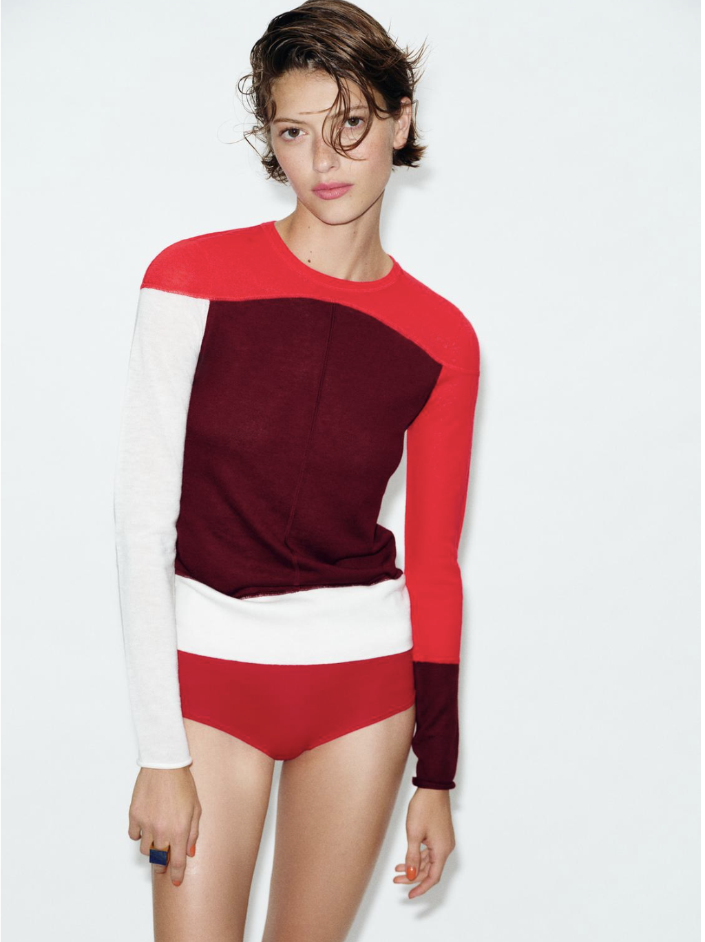 Model wears Zara Spring fashion trends 2026. she wears colour blocked knitwear.
