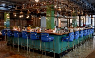 Bar table with blue chairs