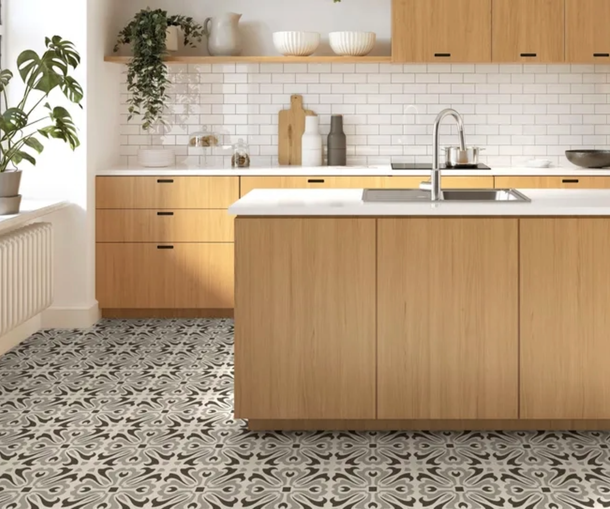 oak cabinets with patterned flooring in modern kitchen