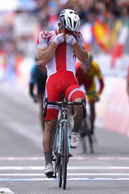 Michal Kwiatkowski (Poland) kisses the Polish badge on his jersey