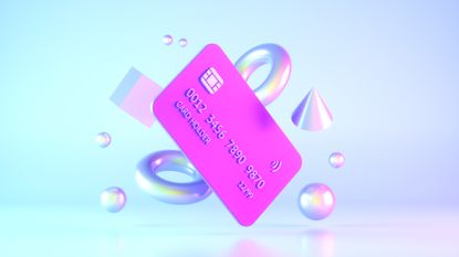 Credit card floating alongside luminous shapes