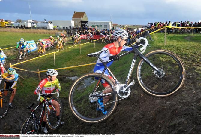 Lars van der Haar pushes his bike