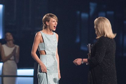 Taylor Swift onstage with Andrea Swift