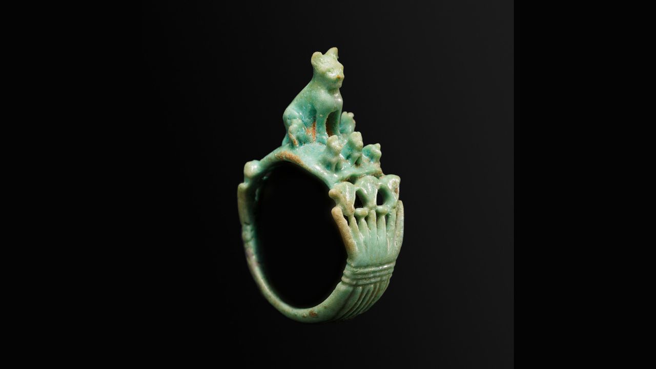 A faience (glazed ceramic) ring of a cat with its kittens, dating to Egypt's Ramesside/Third Intermediate period (1295&ndash;664 B.C.).