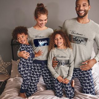 family with grey t-shirt and matching pyjamas