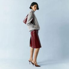 Browns fashion model wearing Gucci skirt bag and shoes
