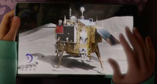 Fei Fei views a photo of China's Chang'e moon lander in the Netflix and Pearl Studio animated film "Over the Moon."
