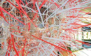 Nicholas Kirk Architects constructed a tree canopy made from thousands of plastic cable ties for Stay Real