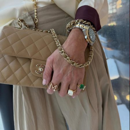 Marci Hirshleifer wearing emerald jewelry