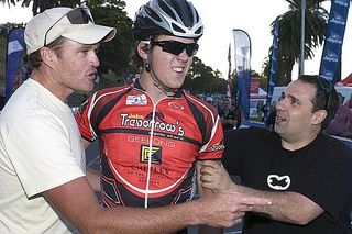 Men's winner Tom Scully (John Trevorrow Cycles/Chifley Hotel) from New Zealand is congratulated by friends John Dam (left) and Tony Crino in Geelong.