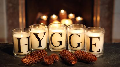 How to make candles last longer, Fireside candles in an English home in winter depict 'hygge' - the Danish concept of embracing cosy contentment and conviviality