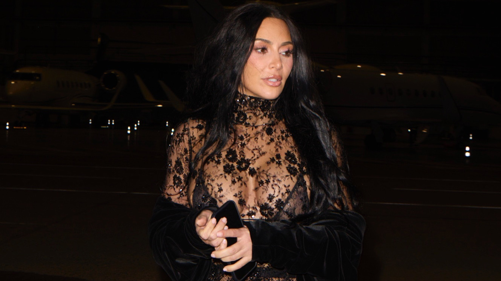 Kim Kardashian was spotted in Paris wearing a lace naked dress and matching velvet cape